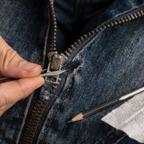 Aprenda a resolver o problema do zíper travado sem danificar o tecido